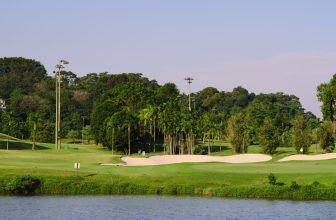 scenic golf course by water on a sunny day