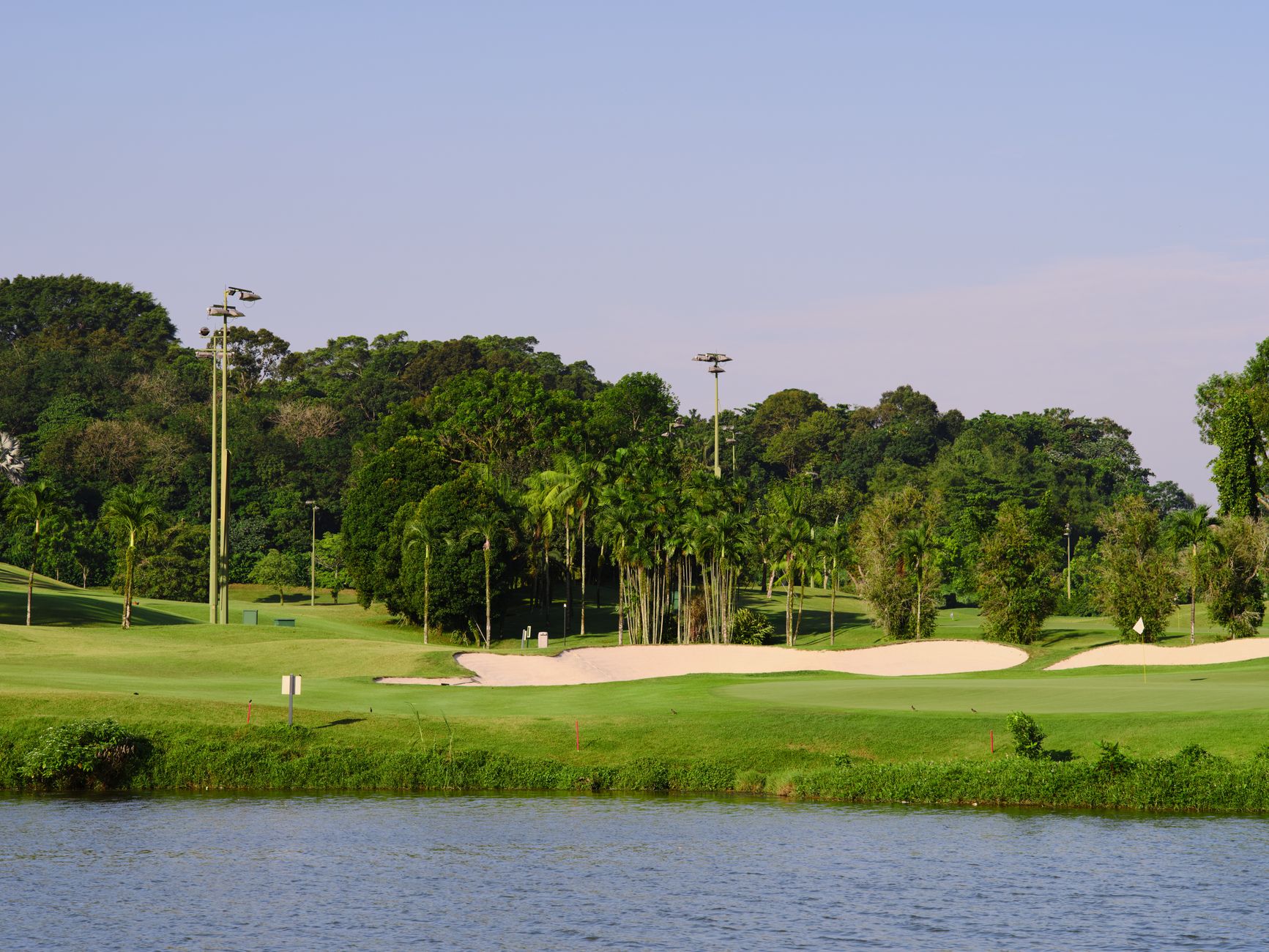 scenic golf course by water on a sunny day